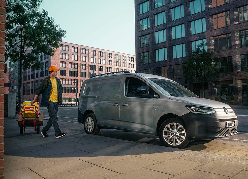 Silver panel van parked in a city