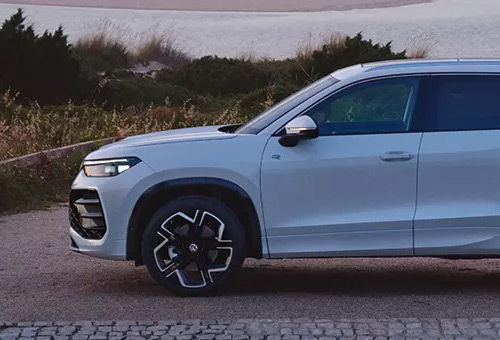 Side profile of a white Tayron SUV