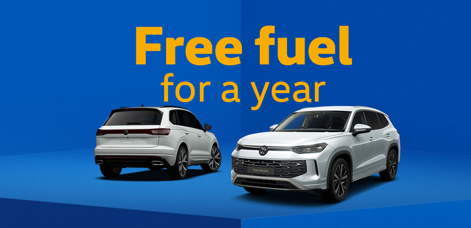 3 White VW models on a blue abstract background